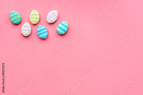 Easter eggs cookies. Easter symbols and traditions. Pink background top view copy space