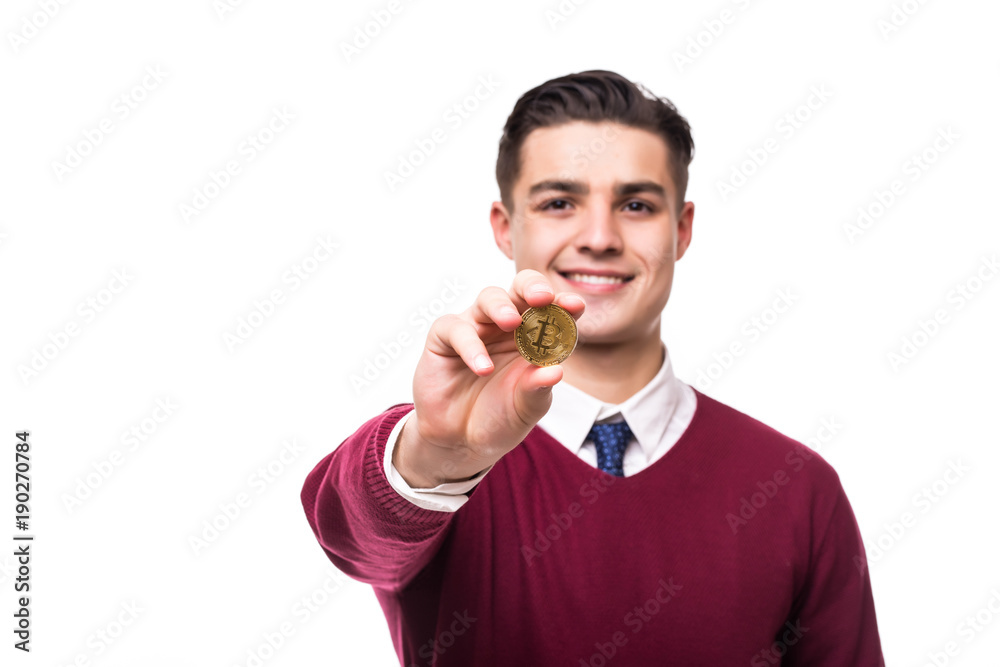 Young handsome man pointed golden bitcoin on camera isolated on white background Young handsome man pointed golden bitcoin on camera isolated on white background