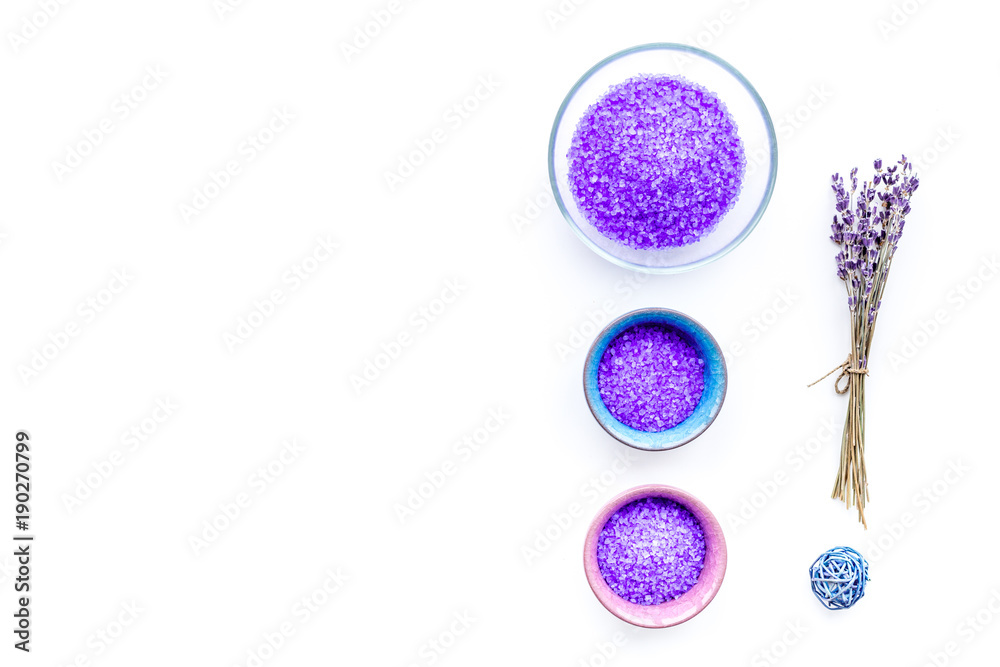 Aromatic spa cosmetics. Lavender violet spa salt on white background top view copy space Aromatic spa cosmetics. Lavender violet spa salt on white background top view copy space