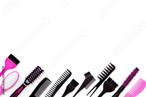 Hairdressing tools. Pattern with various combs and brushes on white background top view copy space