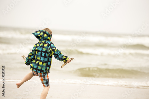 Wallpaper Mural Boy is jumping on the beach Torontodigital.ca