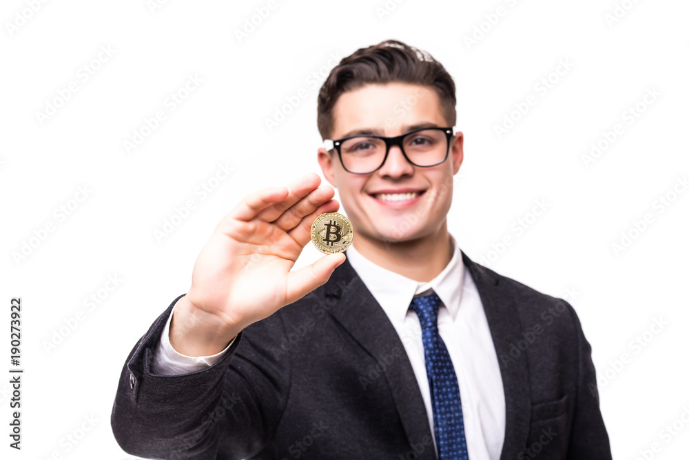 Handsome young business man in suit pointed bitcoin on white background Handsome young business man in suit pointed bitcoin on white background