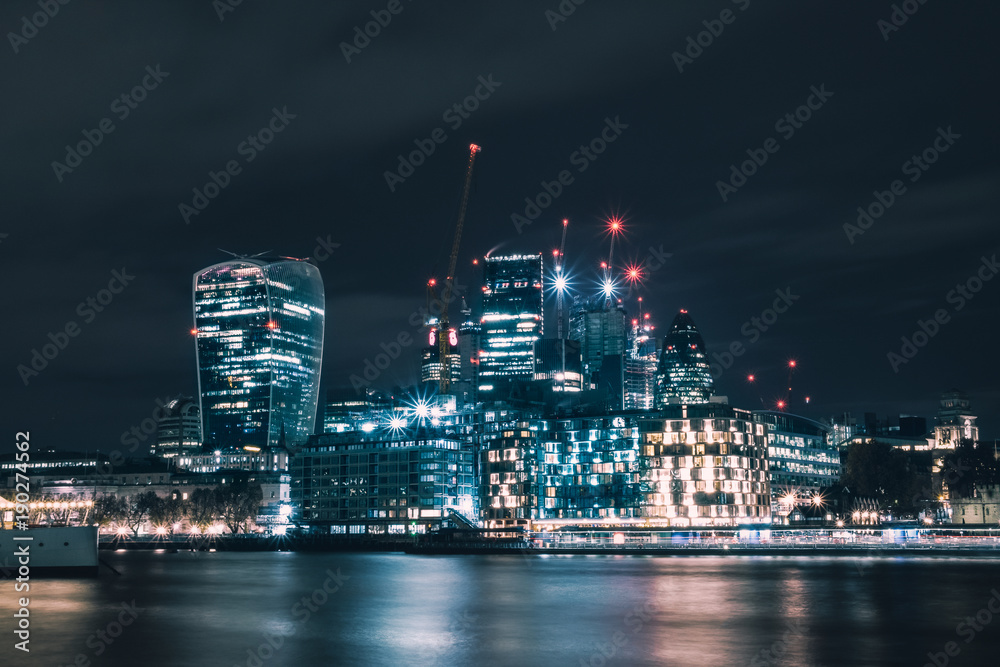 Night view on the City of London and on the river Thames