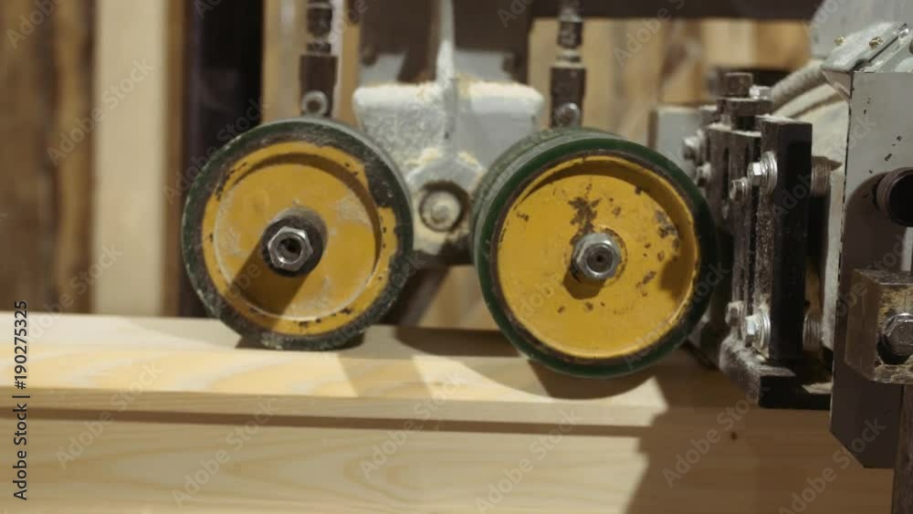 Wood block grinding in woodwork trying-plane machine at sawmill factory, lots of sawdust Wood block grinding in woodwork trying-plane machine at sawmill factory, lots of sawdust