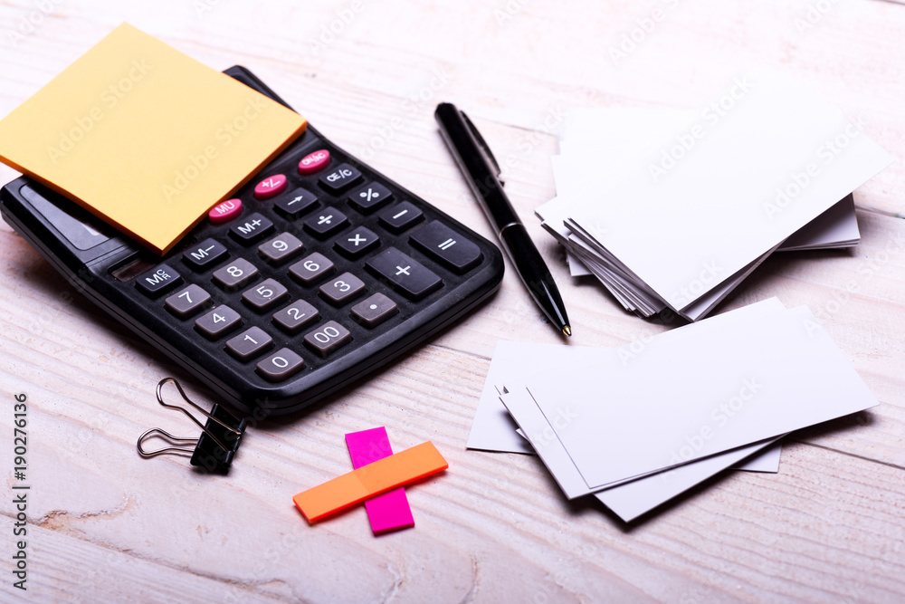 Business idea. Stationery and calculator. Business cards with copy space Business idea. Stationery and calculator. Business cards with copy space