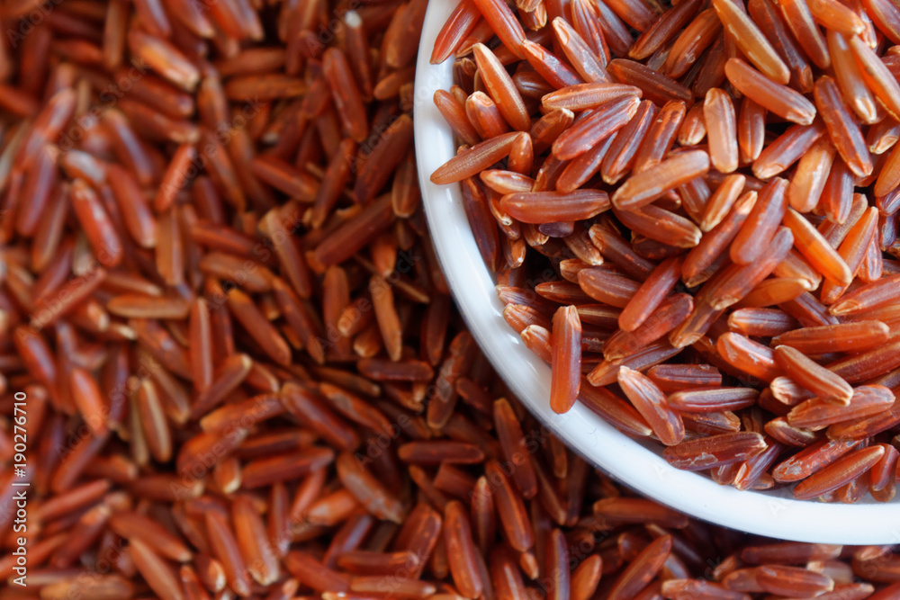 Jasmine Brown wholemeal Rice in small plate The concept of proper nutrition and healthy lifestyle. Top view, close-up as background or texture Jasmine Brown wholemeal Rice in small plate The concept of proper nutrition and healthy lifestyle. Top view, close-up as background or texture