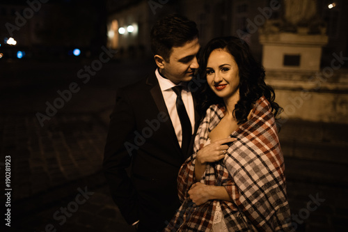 Bride and groom walking through the old town