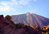 View of volcano El Teide with volcanic rocks in the foreground.Mount Teide at sunset.Teide National Park,Tenerife,Canary Islands,
Spain.Selective focus.