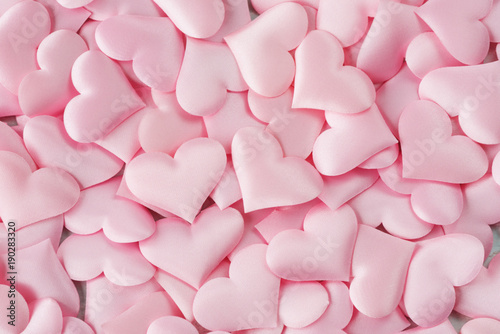 Background of pink silk hearts