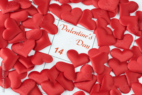 Red silk hearts on the cale...
