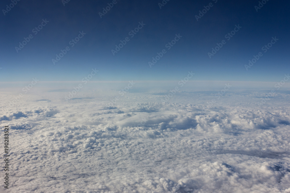 When traveling by plane, tourists can look through the airplane window to the clouds. The expanses of pure sky