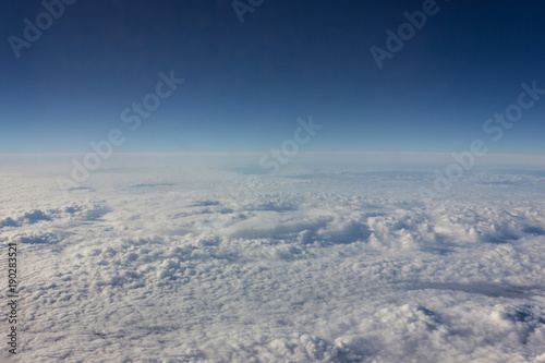 When traveling by plane, tourists can look through the airplane window to the clouds. The expanses of pure sky © HAMERCAT