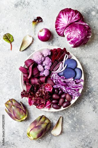 Purple Buddha bowl with spiral carrots, cauliflower, beet, onion, potato, shredded red cabbage, radicchio salad, kalamata olives. Vegan detox veggie bowl © sveta_zarzamora