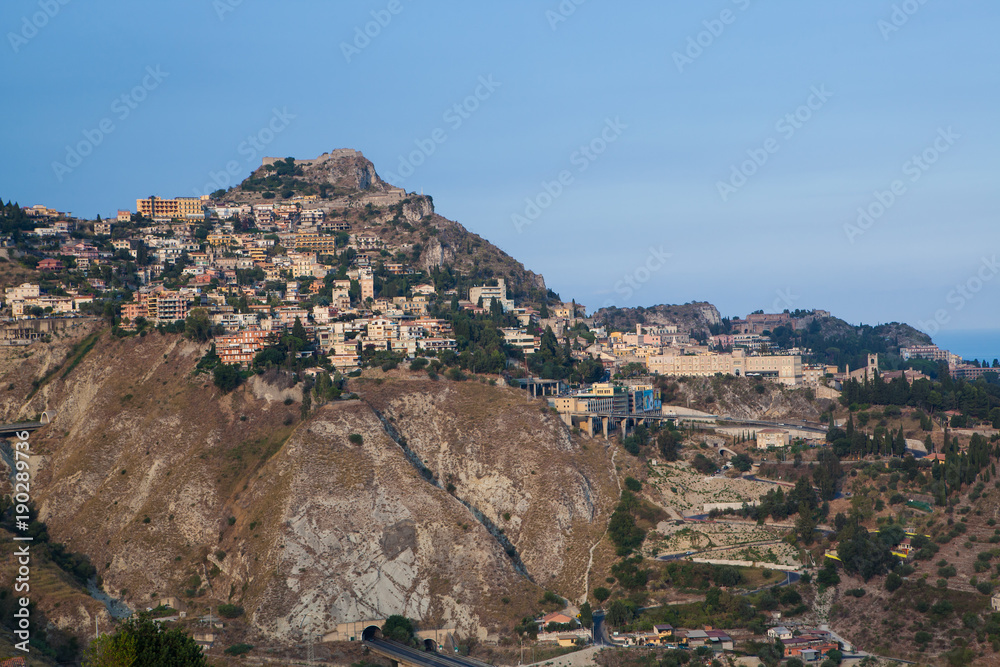 Taormina stands high on cliff overlooking Mediterranean Sea.CR2