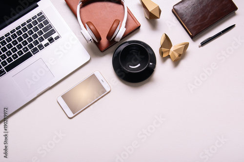 Business background with electronic devices like notebook or mobile phone. Workplace of CEO, chef director, manager or designer. Office flat lay to write words down. Modern informational technologies 