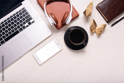 Business background with electronic devices like notebook or mobile phone. Workplace of CEO, chef director, manager or designer. Office flat lay to write words down. Modern informational technologies 