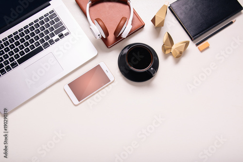 Business background with electronic devices like notebook or mobile phone. Workplace of CEO, chef director, manager or designer. Office flat lay to write words down. Modern informational technologies 