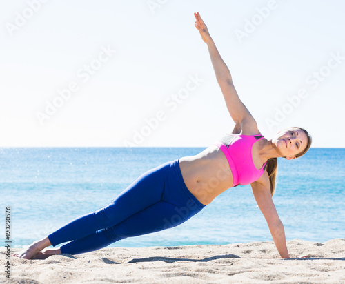 Positive healthy woman stretching body
