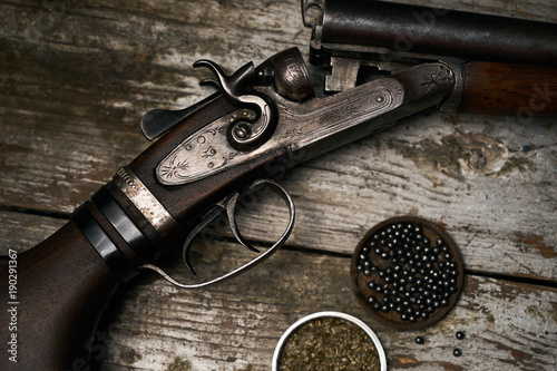 Shotgun rifle with gunpowder and many plumbeous fractions photo
