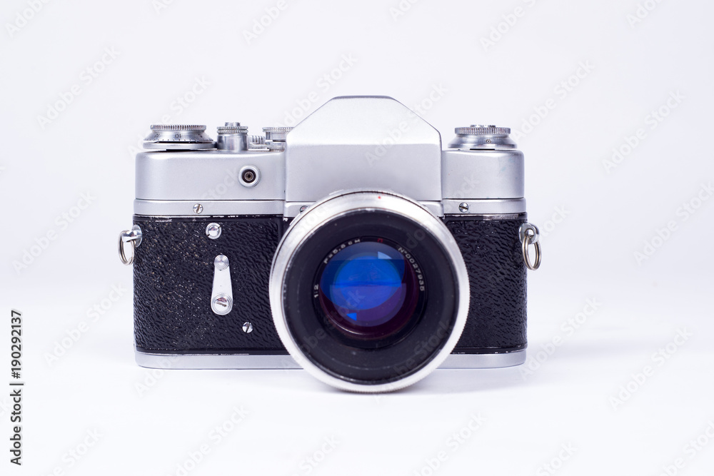 Old film camera. White background close-up. Vintage photo