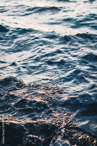 Fototapeta Naklejka Na Ścianę i Meble -  Close up of sea water. Sun reflecting in the water.
