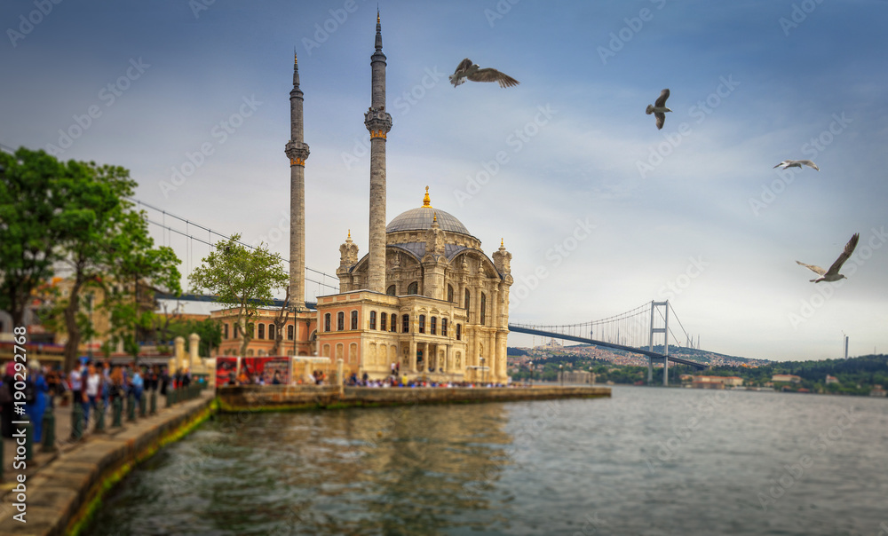 Panoramic view of the famous Ortakoy mosque (Ortakoy Camii) and Bosphorus bridge. Istanbul. Turkey.