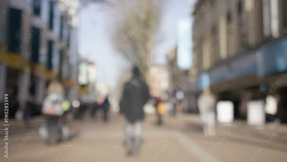 Blurred background of pedestrians in a high street, in slow motion Blurred background of pedestrians in a high street, in slow motion