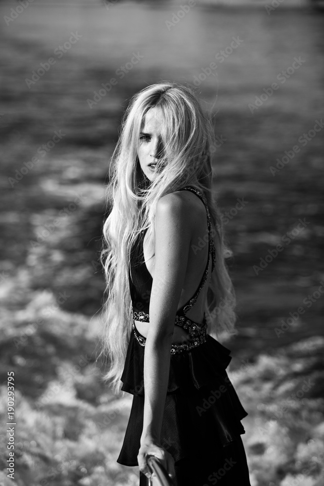 blonde in black long dress floating on a yacht blonde in black long dress floating on a yacht