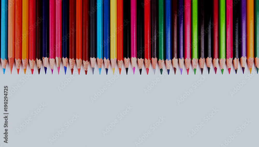 Assortment of coloured pencils with shadow on white background. Assortment of coloured pencils with shadow on white background.