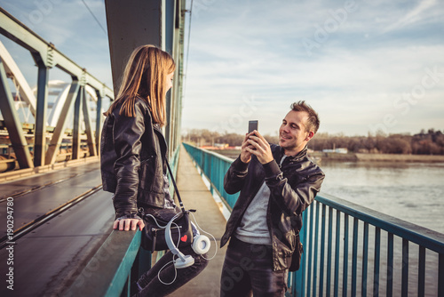 Father and daughter taking photos on the bridge © kerkezz