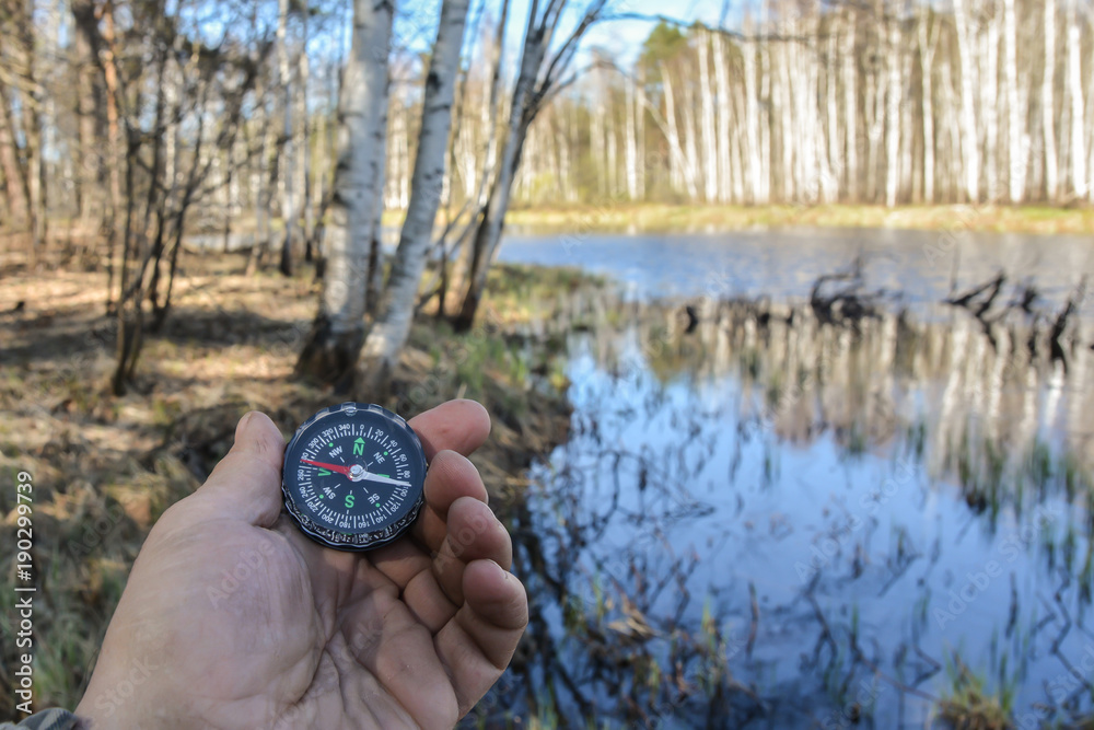 Compass in hand.
