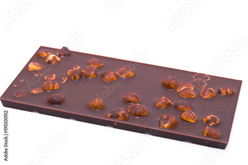 Bar Milk Chocolate with nuts. Background. Close-up photo