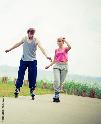 roller skater couple skating outdoor