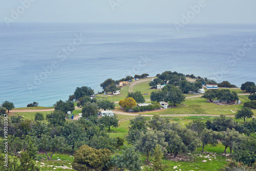 Looking across a campsite towards Chrysohou Bay, Laatchi, Polis and the Troodos Mountains photo