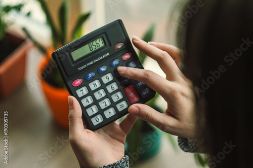woman working with calculator