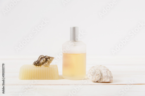 bottle of perfume,sea shells and hand made soap.