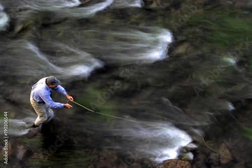 Fototapet Fly Fisherman with Moving Water