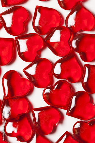 Red love hearts on a plain white background