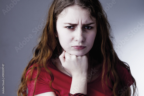 Fotografie Young sad and desperate woman suffering from a severe depression, anxiety, sudde