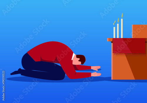 Businessman praying in front of incense