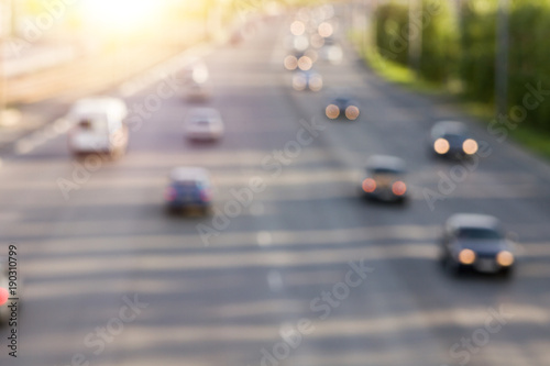 Blurred in the side texture of the road with the traveling cars with the lights on. © gerasimov174