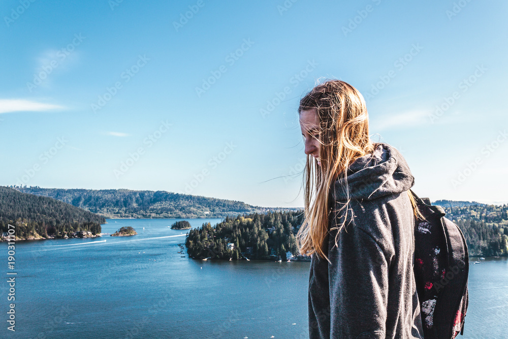 Backpacker Girl on top of Quarry Rock at North Vancouver, BC, Canada