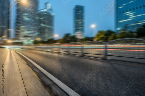 blurred road with shanghai city skyline background in china