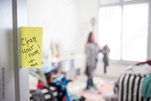 Teenage girl in messy room © MeganBetteridge