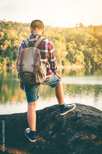 Tourists boy travel in the nature for a holiday. photo