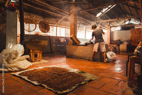 Man making puffed rice photo