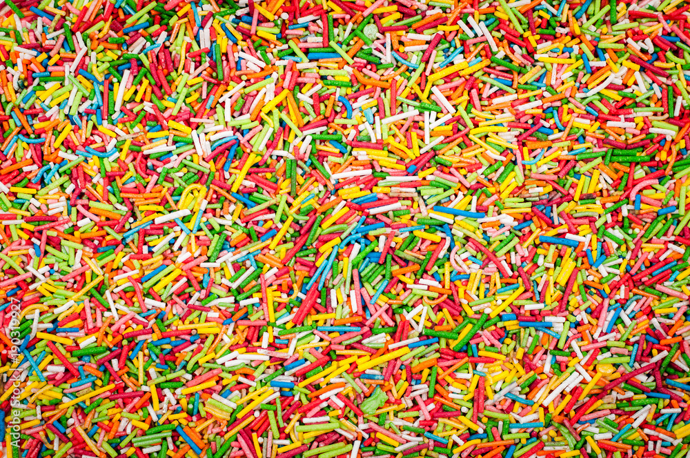 Sugar sprinkle dots. Decoration for cake and bekery. Many sprinkles as background.