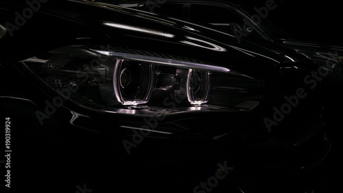 Modern car headlights detail.