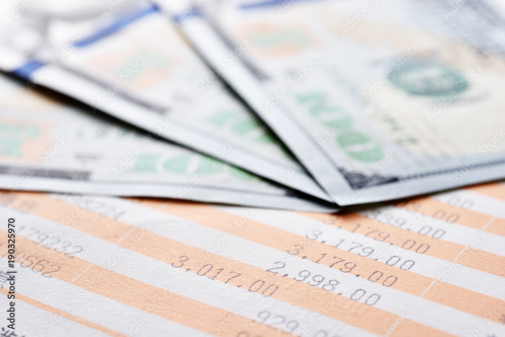 Close up saving account passbook and United States dollar Close up saving account passbook and United States dollar