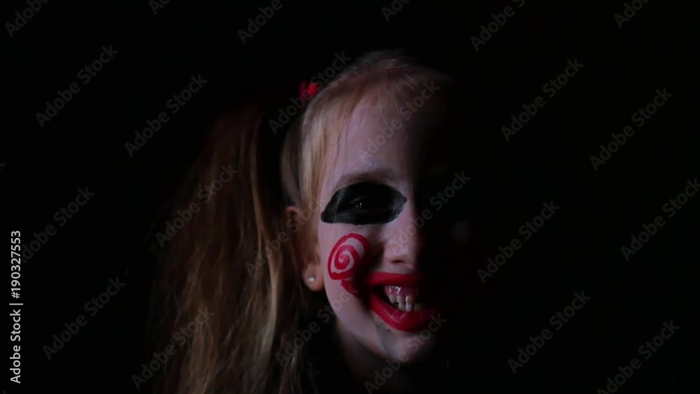 Young girl with film cosplay makeup. Girl with make-up in nightmare style a black background. Young girl with film cosplay makeup. Girl with make-up in nightmare style a black background.